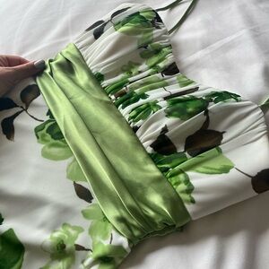 Green, brown, and white floral dress with green sash. Size small